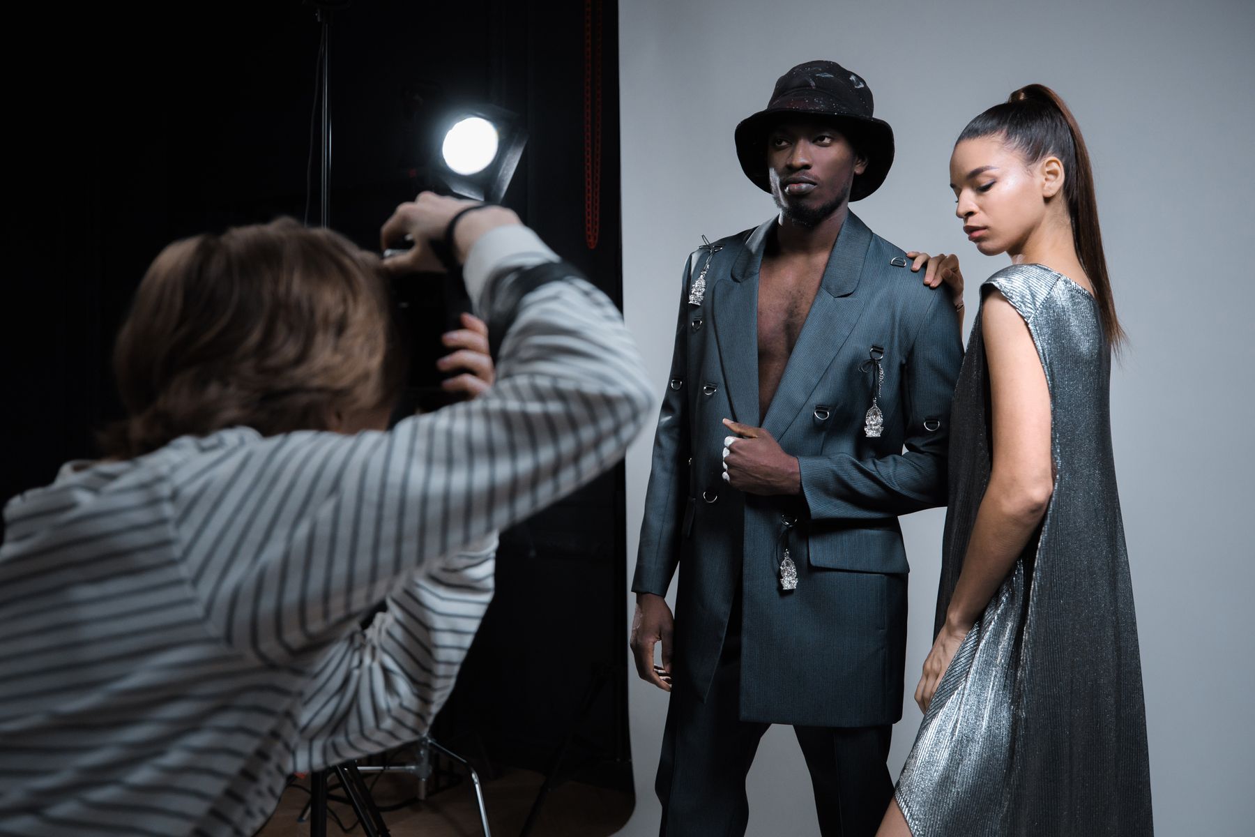 Fashion models photographed during a studio production