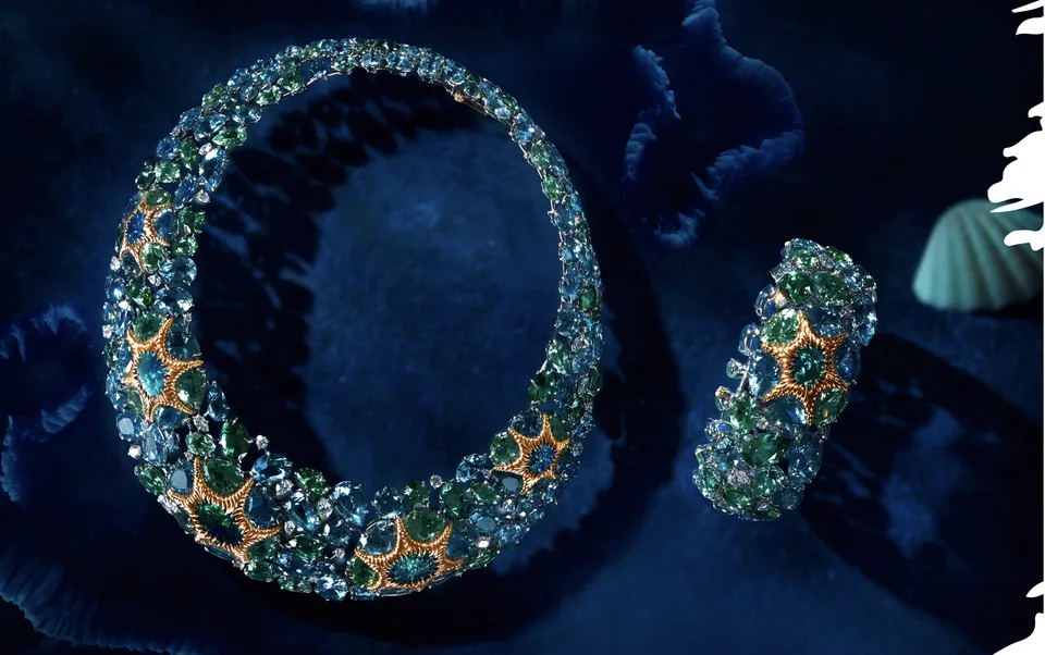 Fine jewelry campaign compositions finished against a deep blue set